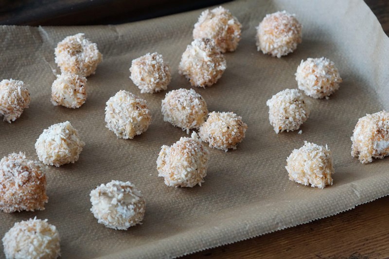 breaded mushrooms on baking sheet