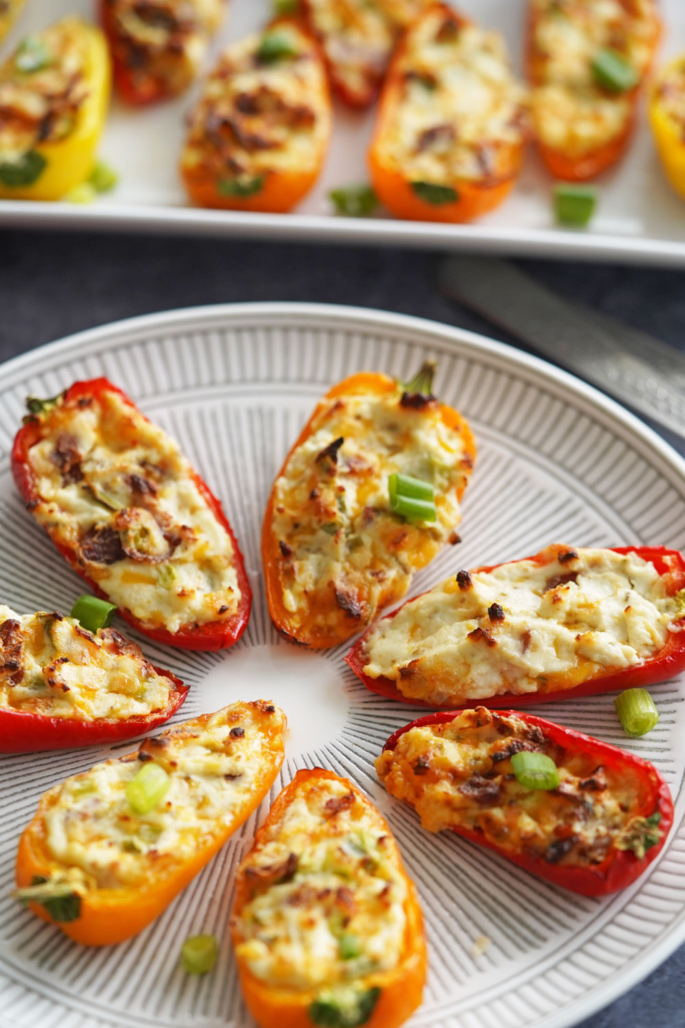 Cream cheese stuffed peppers on a platter