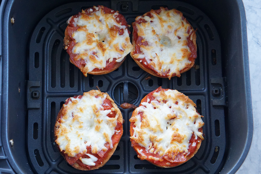 cooked homemade bagel bites in the air fryer basket