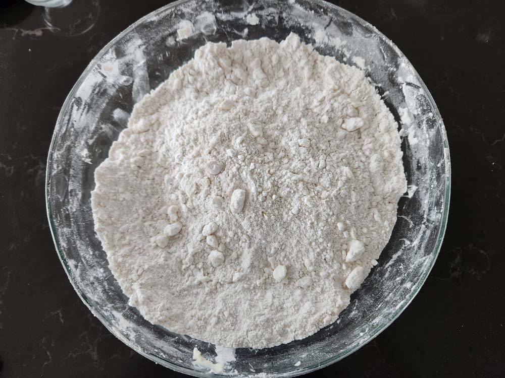 dry ingredients for biscuits with butter cut in.