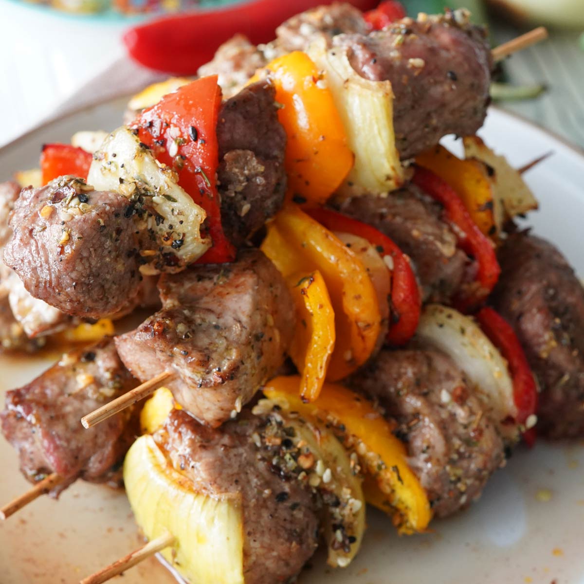 A stack of pork kebabs on a plate