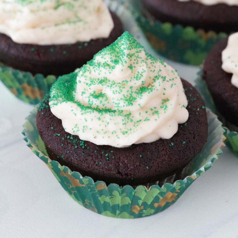 Guinness cupcakes with Irish cream frosting and green sprinkles.