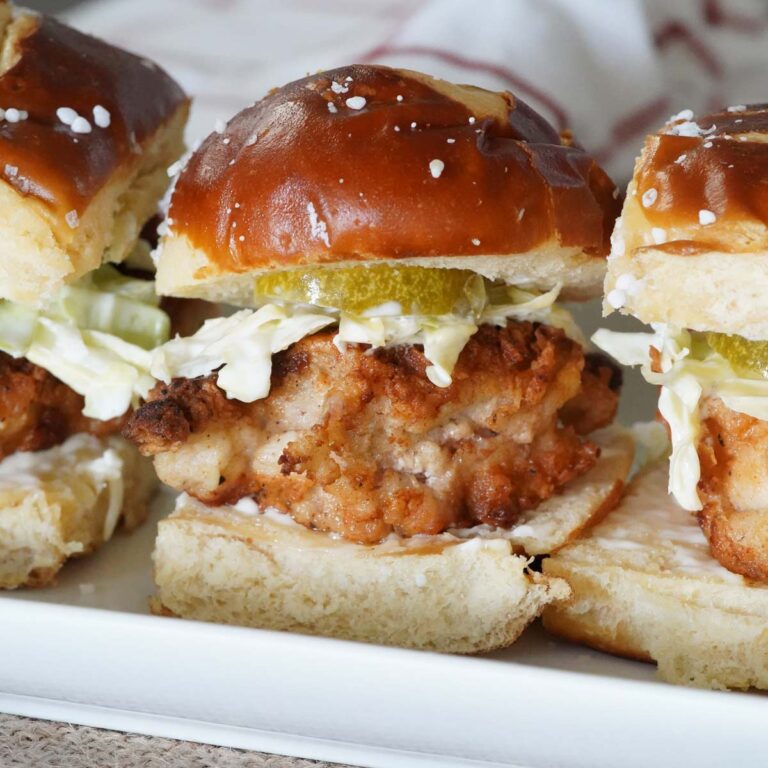 A plate of fried chicken sliders