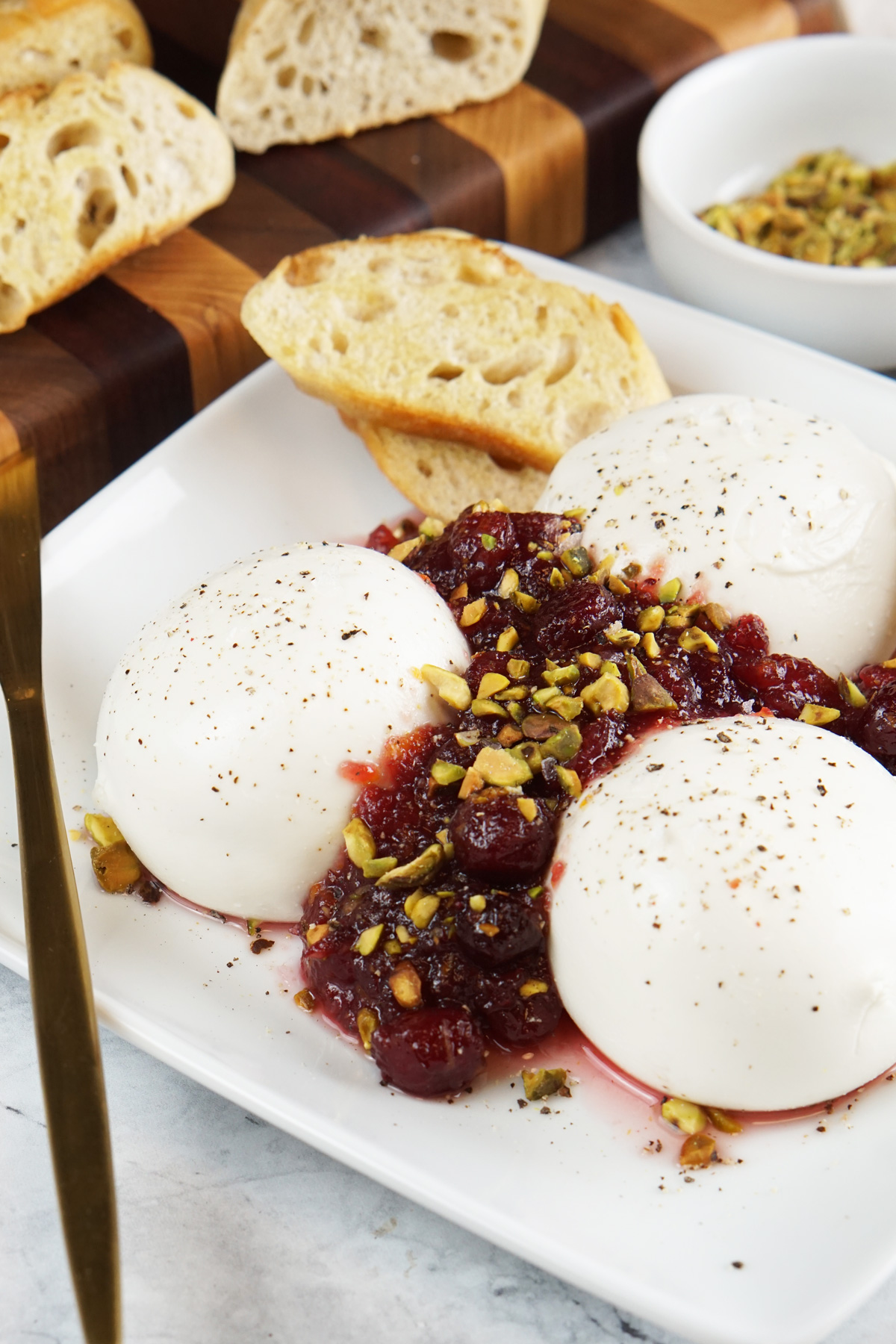 Burrata with cranberries and pistachios