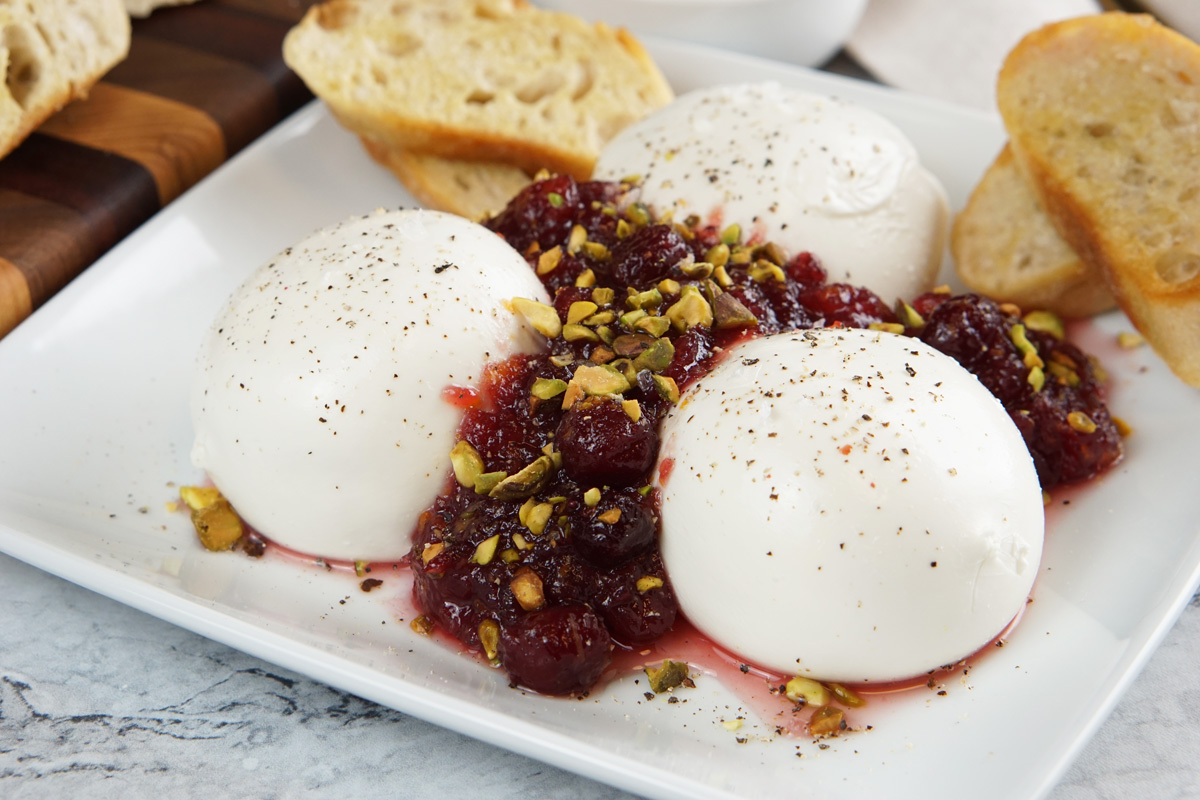 Burrata with cranberries and pistachios