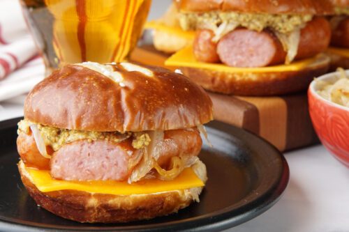 Bratwurst slider on a pretzel roll