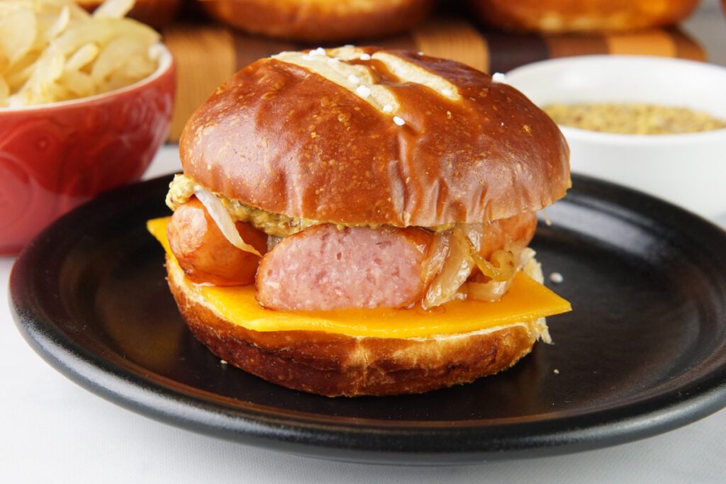 Bratwurst slider on a pretzel roll
