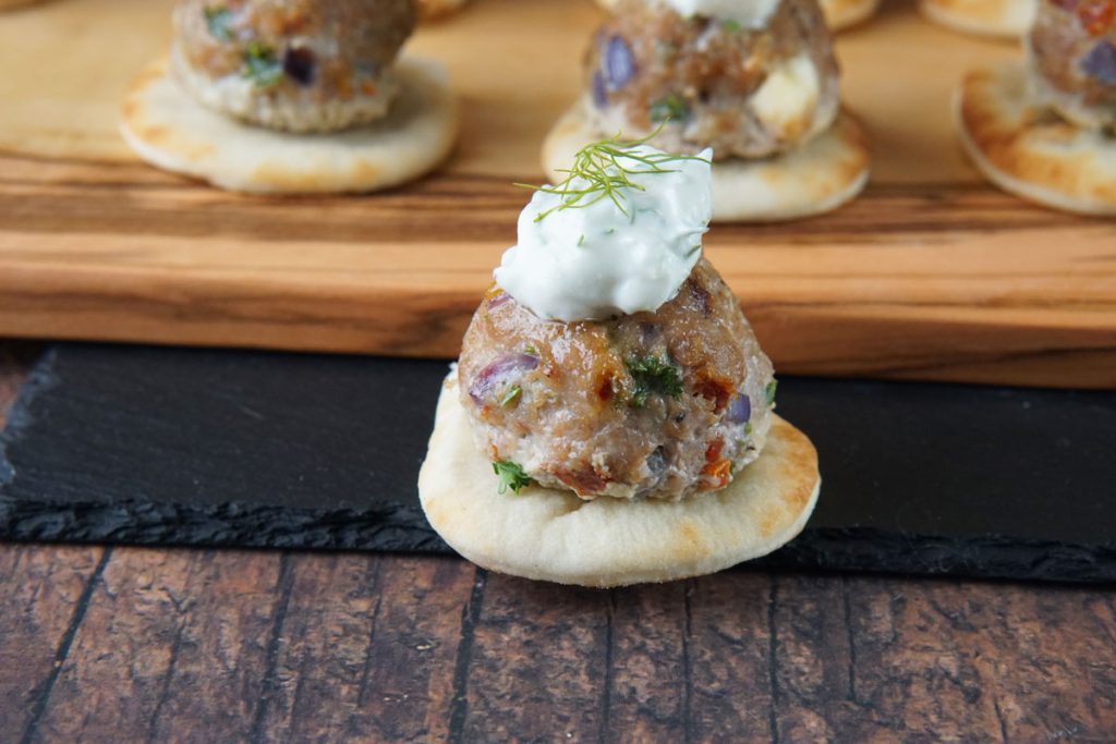 Greek meatballs on naan with tzatziki