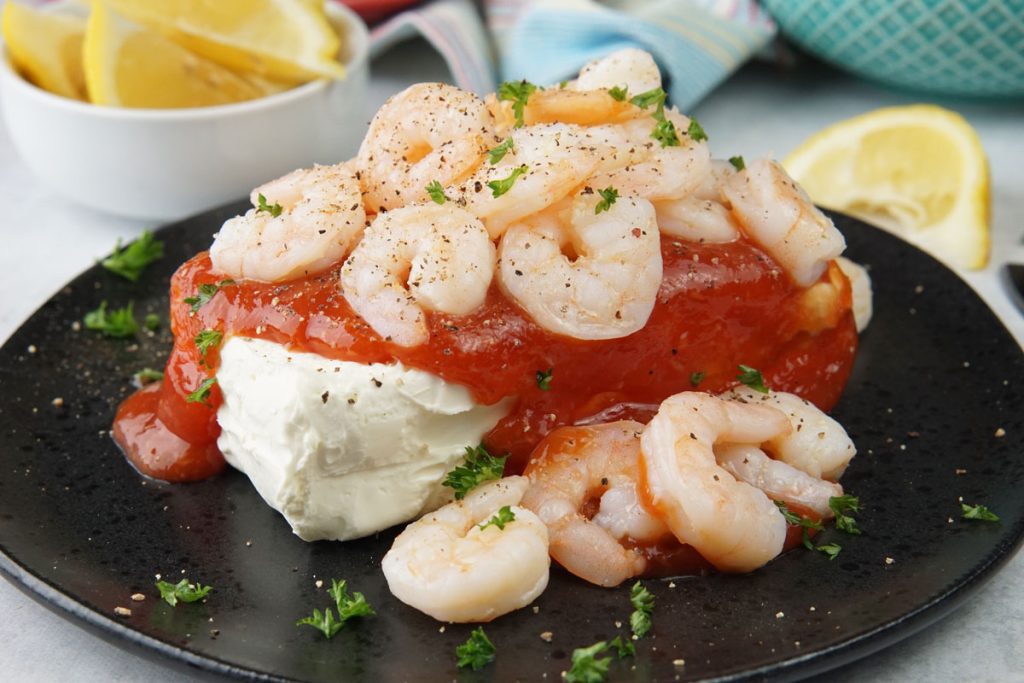 Shrimp and cream cheese on a cracker